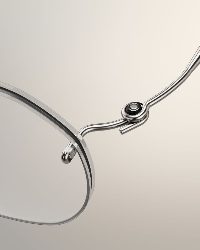Détail d’une monture Lindberg Spirit Titanium sans cercle : charnière en fil de titane